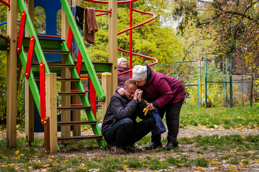 Neighbors comfort a man who lost his son in Russia's drone attacks that hit residential buildings in Kyiv, Ukraine, Sunday, Oct. 26, 2025 (AP Photo/Dan Bashakov) Neighbors comfort a man who lost his son in Russia's drone attacks that hit residential buildings in Kyiv, Ukraine, Sunday, Oct. 26, 2025 (AP Photo/Dan Bashakov)