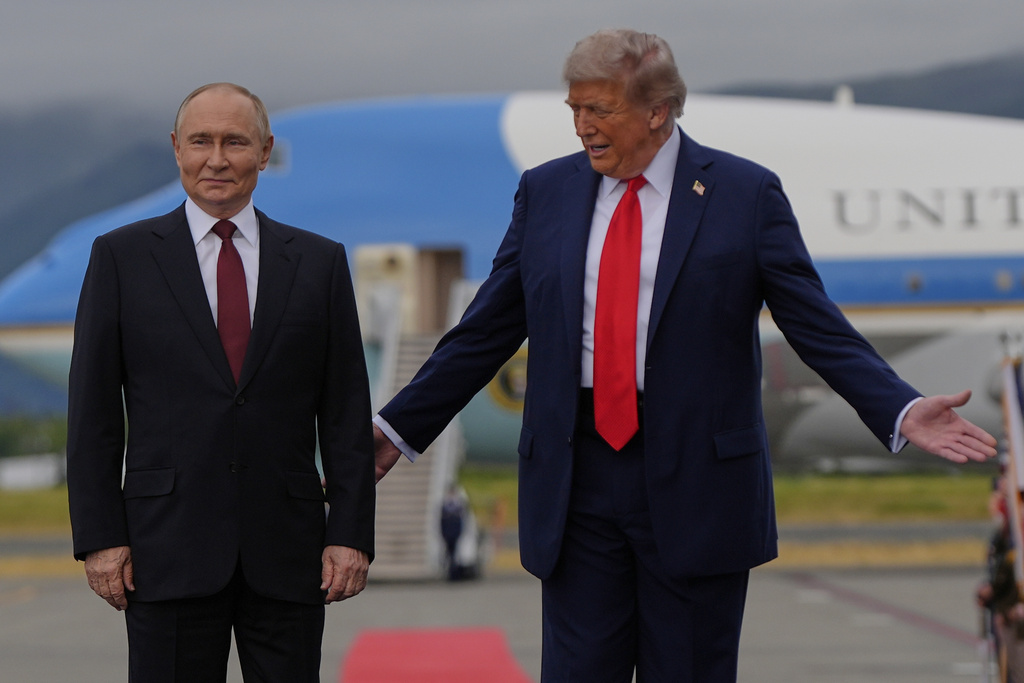 President Donald Trump greets Russia's President Vladimir Putin Friday, Aug. 15, 2025, at Joint Base Elmendorf-Richardson, Alaska. (AP Photo/Julia Demaree Nikhinson)
