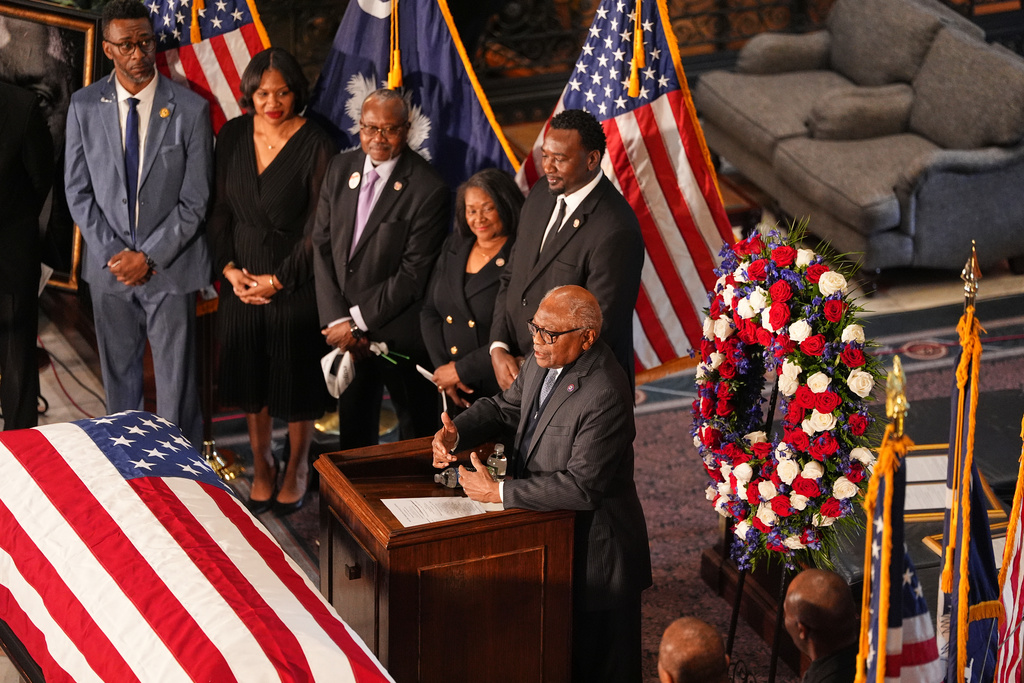 Rep. Jim Clyburn, D-S.C., speaks to people inside the South Carolina Statehouse as the Rev. Jesse Jackson lies in state Monday, March 2, 2026, in Columbia, S.C. (AP Photo/Matt Kelley, Pool)