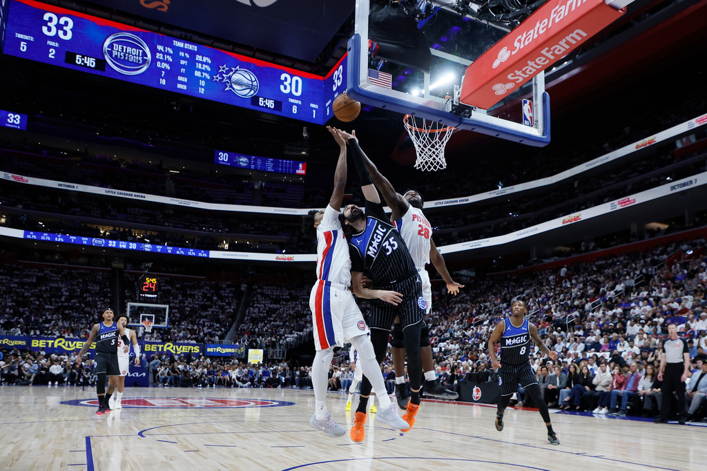 Detroit Pistons guard Ausar Thompson (9) and forward Isaiah Stewart (28) defend against a shot Orlando Magic center Goga Bitadze (35) during the first half in Game 2 of a first-round NBA basketball playoffs series Wednesday, April 22, 2026, in Detroit. (AP Photo/Duane Burleson)