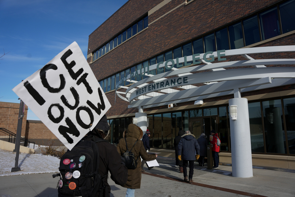 People arrive for an MLK rally on, Monday, Jan. 19, 2026 in St. Paul, Minn. (AP Photo/Angelina Katsanis)