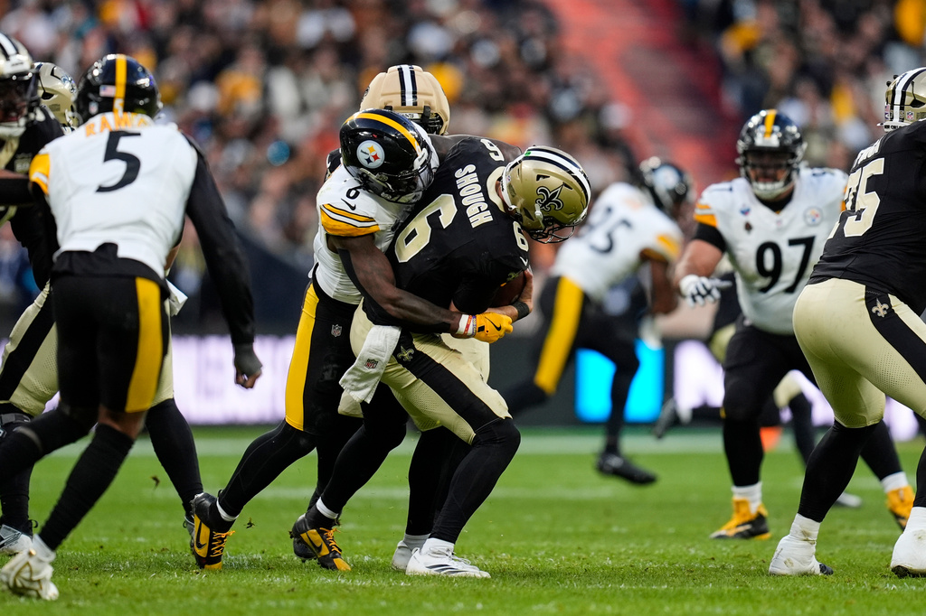Pittsburgh Steelers linebacker Patrick Queen (6) sacks on New Orleans Saints quarterback Tyler Shough (6) during an NFL football game in Saint-Denis, outside Paris, Sunday, Oct. 25, 2026. (AP Photo/Steve Luciano)