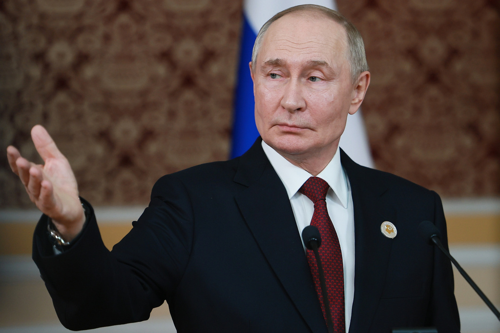 Russian President Vladimir Putin holds a news conference after the summit of the Commonwealth of Independent States in Dushanbe, Tajikistan, Friday, Oct. 10, 2025. (Vladimir Smirnov, Sputnik, Kremlin Pool Photo via AP)