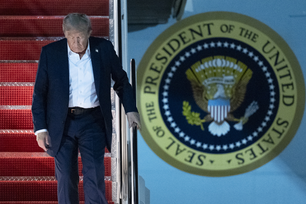 President Donald Trump disembarks Air Force One as he arrives at Joint Base Andrews, Md., early Saturday, Aug. 16, 2025, from a summit with Russian President Vladimir Putin in Anchorage, Alaska. (AP Photo/Manuel Balce Ceneta)