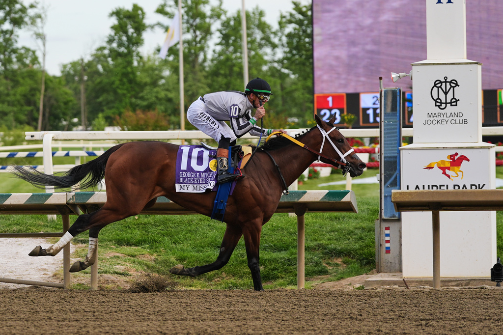 Tyler Gaffalione, atop My Miss Mo, crosses the finish line to win the 102nd running of the Black-Eyed Susan horse race, Friday, May 15, 2026, at Laurel Park in Laurel, Md. (AP Photo/Stephanie Scarbrough)