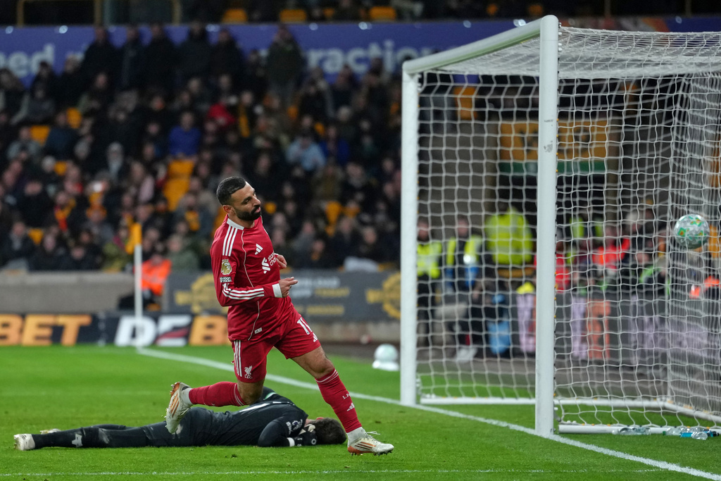 Liverpool's Mohamed Salah scores his side's opening goal during the English Premier League soccer match between Wolverhampton Wanderers and Liverpool in Wolverhampton, England, Tuesday, March 3, 2026. (AP Photo/Dave Shopland)