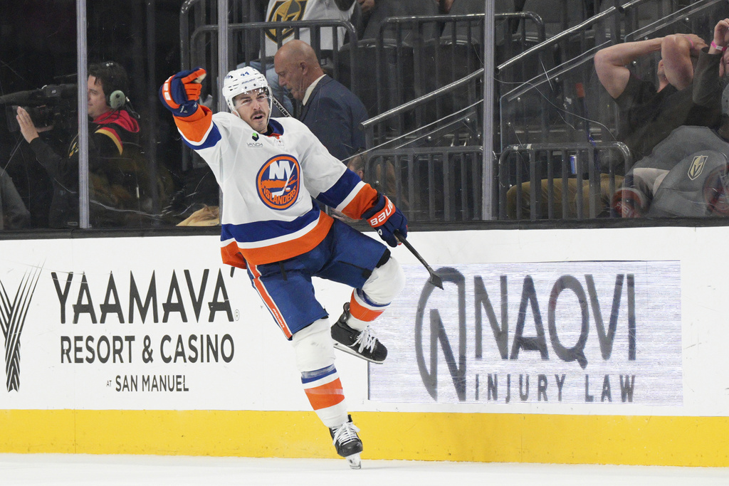 New York Islanders center Jean-Gabriel Pageau (44) celebrates his goal against the Vegas Golden Knights in overtime of an NHL hockey game Thursday, Nov. 13, 2025, in Las Vegas. (AP Photo/Candice Ward)