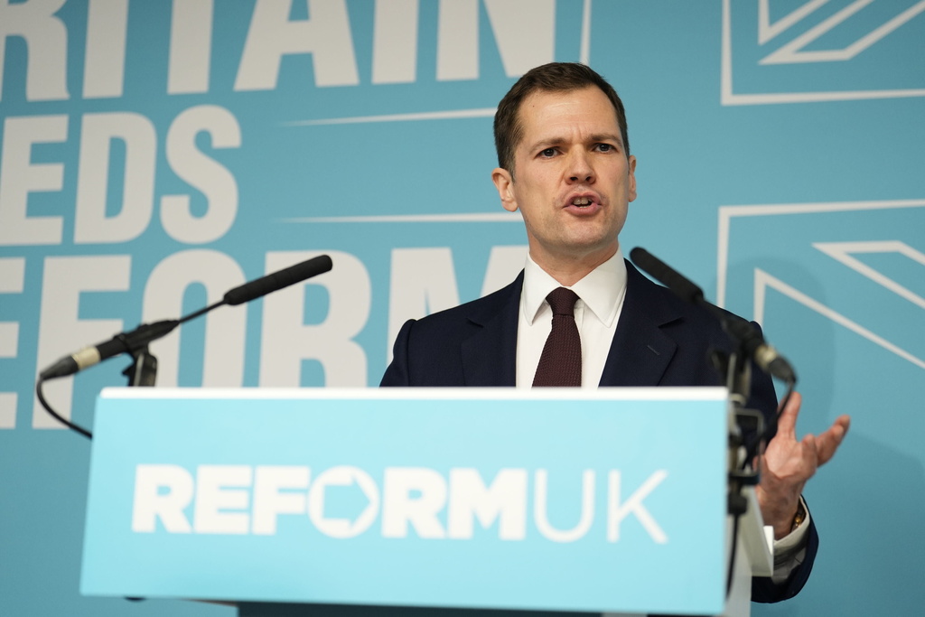 Robert Jenrick speaking at a Reform UK press conference in Westminster, London, where it was announced the former Conservative MP has joined Reform UK, Thursday, Jan. 15, 2026. (Jordan Pettitt/PA via AP)