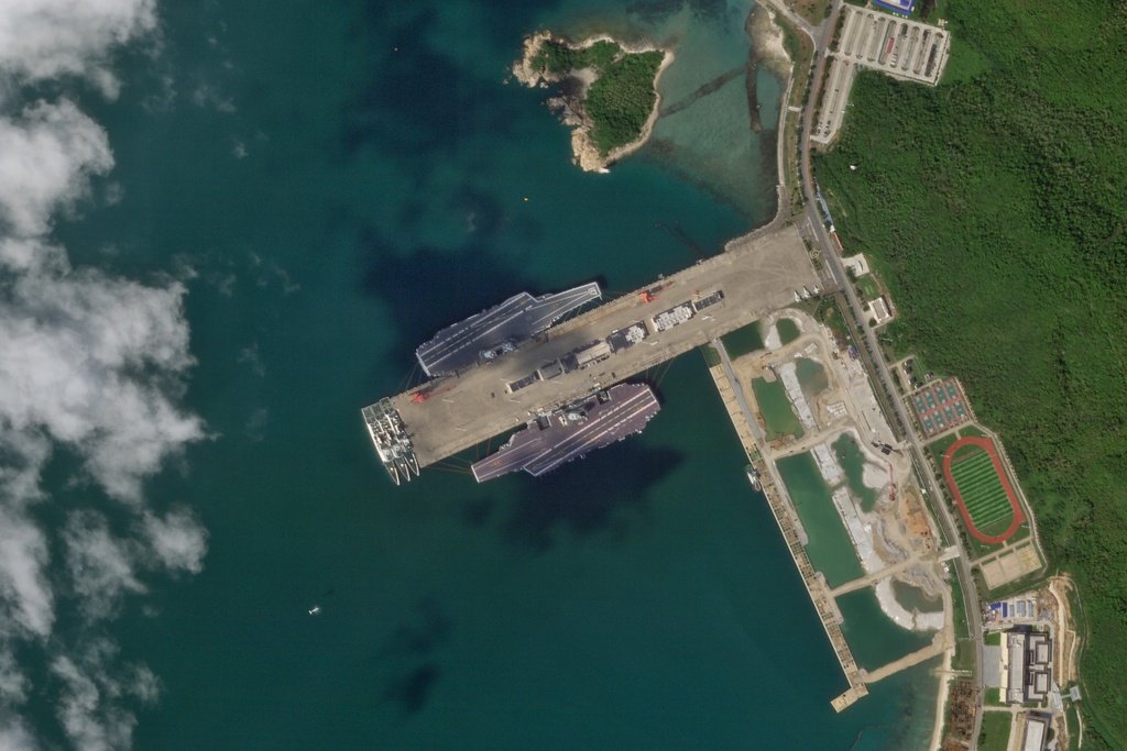 In this Oct. 8, 2025, satellite photo from Planet Labs PBC, the Chinese aircraft carriers Shandong and Fujian are seen at the Yulin Naval Base near Sanya, China. (Planet Labs PBC via AP)
