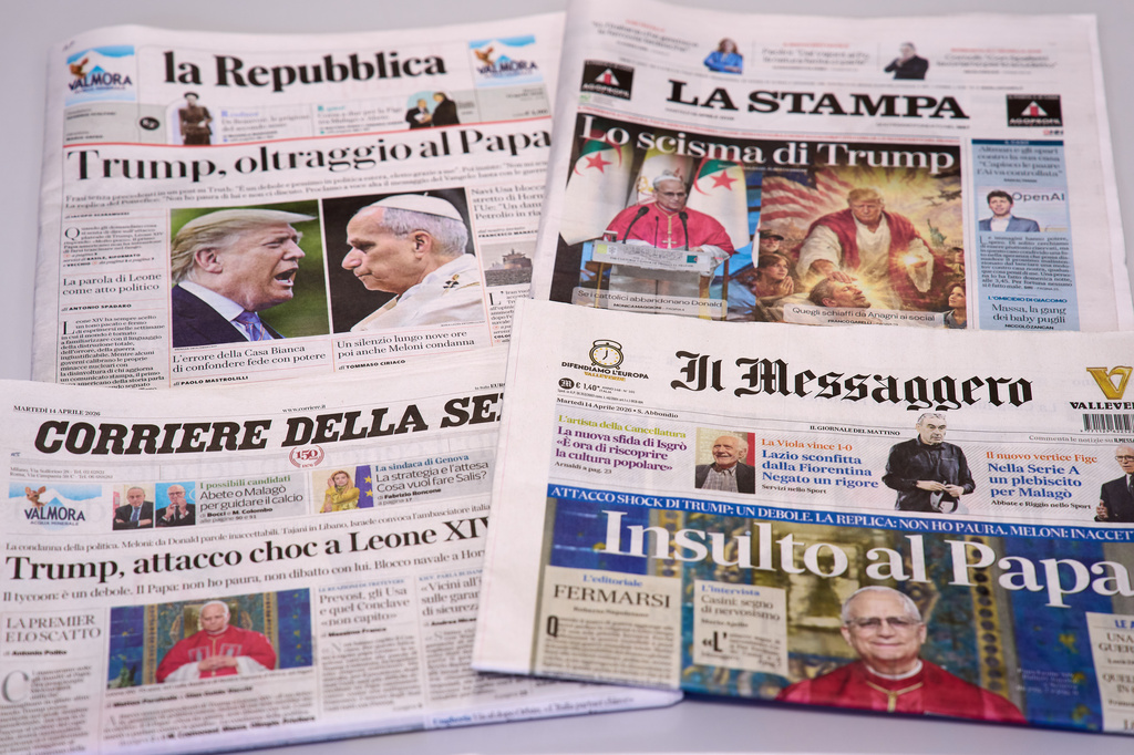 This picture, taken Tuesday, April 14, 2026, shows the front pages of some Italian newspapers reporting on comments by U.S. President Donald Trump about Pope Leo XIV, with headlines using words such as "outrage", "shock attack", "insult", and Trump's schism". (AP Photo/Domenico Stinellis)