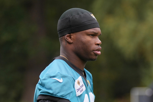 Jacksonville Jaguars wide receiver Travis Hunter (12), attends an NFL football practice at The Grove in Watford, England, Friday, Oct. 17, 2025. (AP Photo/Kin Cheung) Jacksonville Jaguars wide receiver Travis Hunter (12), attends an NFL football practice at The Grove in Watford, England, Friday, Oct. 17, 2025. (AP Photo/Kin Cheung)