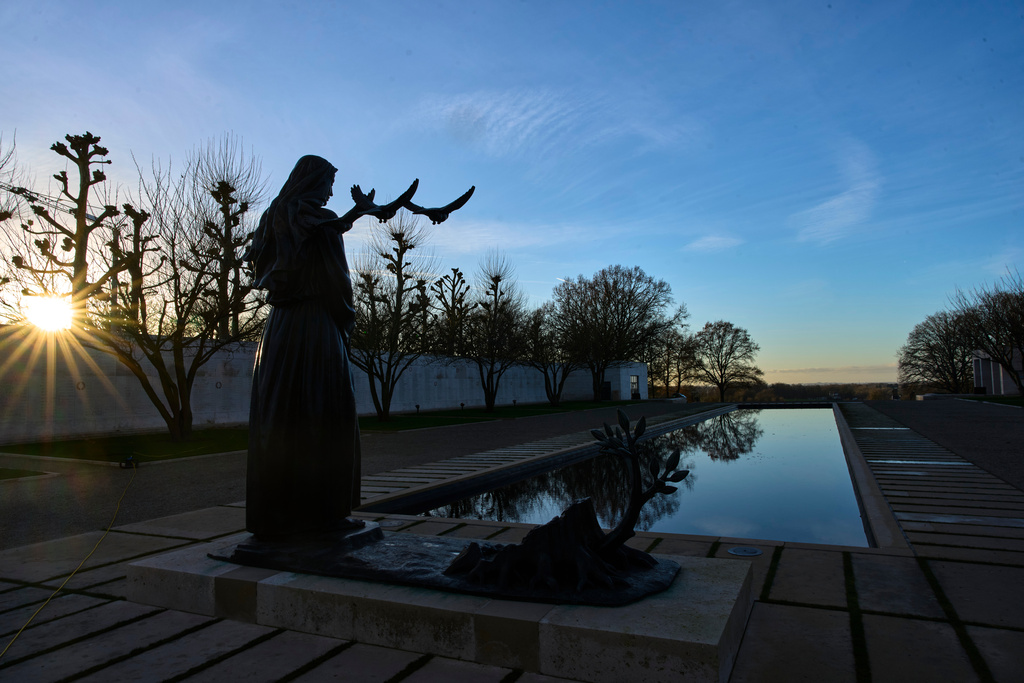 The sun sets over the Netherlands American Cemetery in Margraten, Netherlands, Thursday, Dec. 11, 2025, where the American Battle Monuments Commission removed two displays honoring Black liberators from the visitors center. (AP Photo/Peter Dejong)