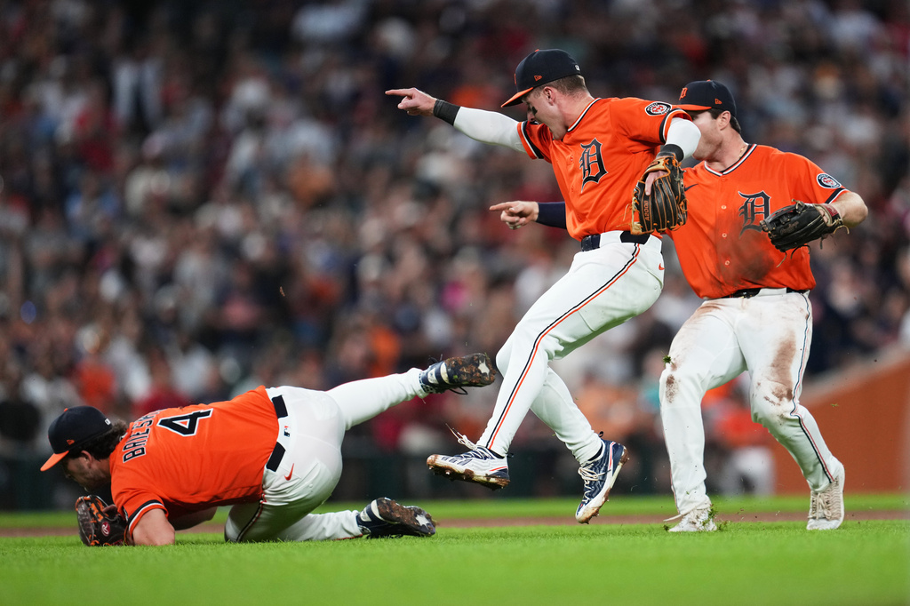 Detroit Tigers pitcher Beau Brieske (4) catches a Philadelphia Phillies' Rafael Marchán pop up as Kevin McGonigle, center, and Colt Keith, right, react to the final out during the ninth inning Friday, July 10, 2026, in Detroit. (AP Photo/Paul Sancya)