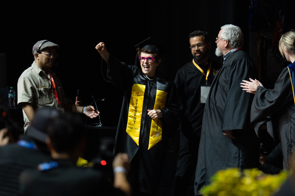 Tennis legend Billie Jean King raises her fist after being called to receive her diploma during California State University, Los Angeles, commencement in Los Angeles, Monday, May 18, 2026. (AP Photo/Jae C. Hong)