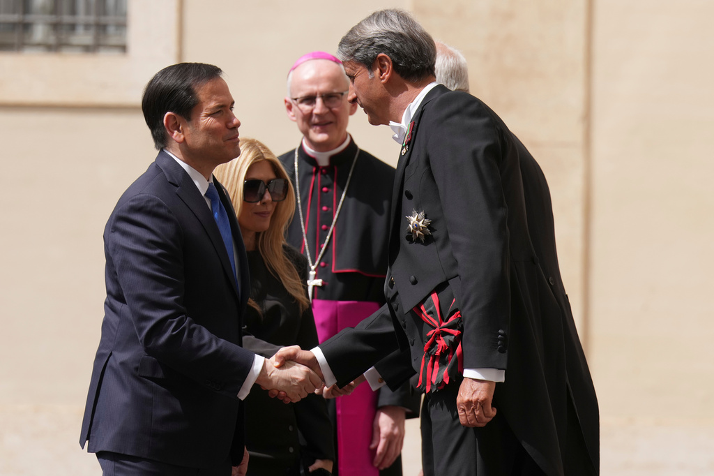 US Secretary of State Marco Rubio is greeted by a Vatican official as he arrives at the St. Damasus courtyard to meet with Pope Leo XIV and Vatican Secretary of State Pietro Parolin the Vatican, Thursday, May 7, 2026. (AP Photo/Andrew Medichini, Pool)