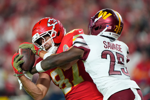 Kansas City Chiefs tight end Travis Kelce catches a touchdown pass as Washington Commanders safety Darnell Savage (25) defends during the second half of an NFL football game Monday, Oct. 27, 2025, in Kansas City, Mo. (AP Photo/Charlie Riedel) Kansas City Chiefs tight end Travis Kelce catches a touchdown pass as Washington Commanders safety Darnell Savage (25) defends during the second half of an NFL football game Monday, Oct. 27, 2025, in Kansas City, Mo. (AP Photo/Charlie Riedel)