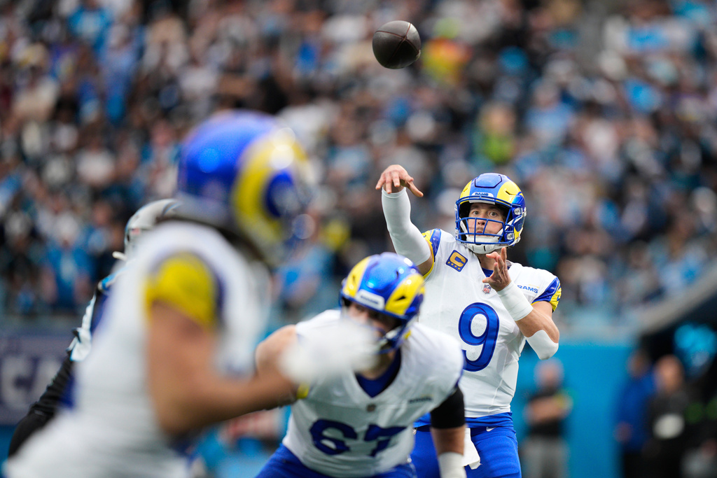 Los Angeles Rams quarterback Matthew Stafford (9) throws a pass during the first half of an NFL divisional playoff football game against the Carolina Panthers, Saturday, Jan. 10, 2026, in Charlotte, N.C. (AP Photo/Jacob Kupferman)