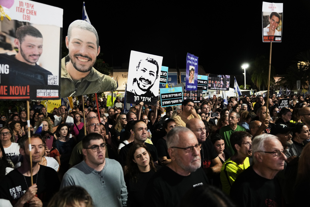 Relatives and supporters of hostages held by Hamas in the Gaza Strip attend a rally calling for their immediate release in Tel Aviv, Israel, Saturday, Oct. 25, 2025. (AP Photo/Mahmoud Illean)