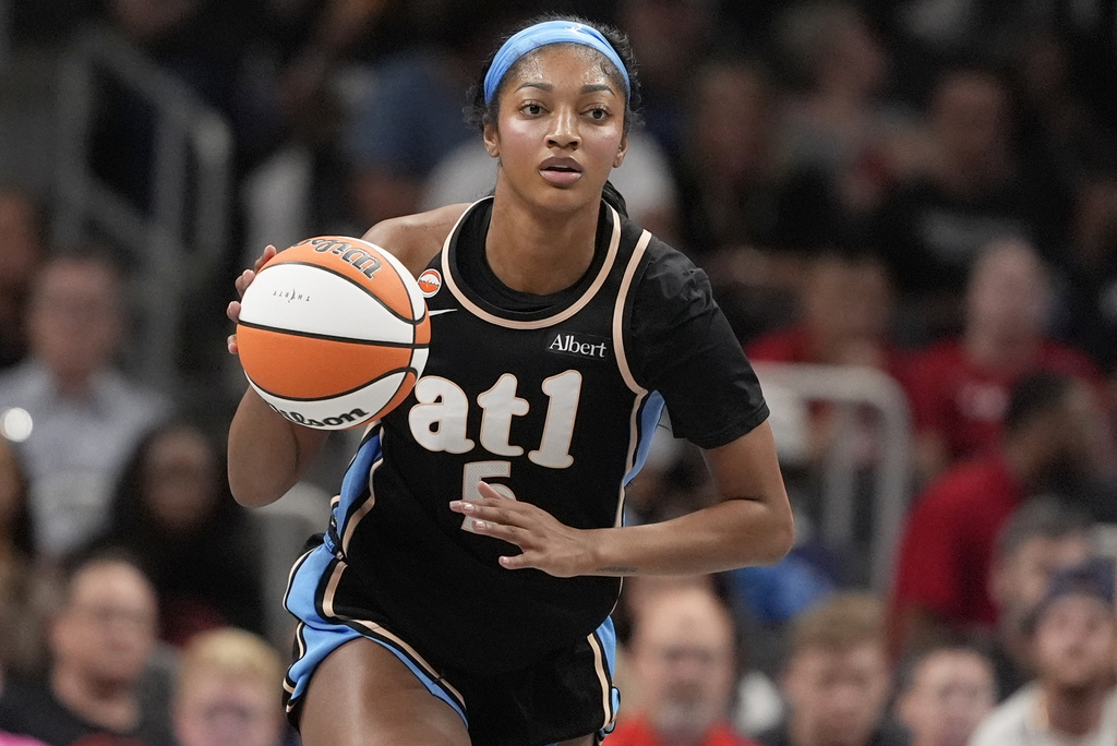 FILE - Atlanta Dream forward Angel Reese (5) dribbles in the first half of an WNBA basketball game against the Sunday, Aug. 16, 2026, in Atlanta. (AP Photo/Brynn Anderson, File)