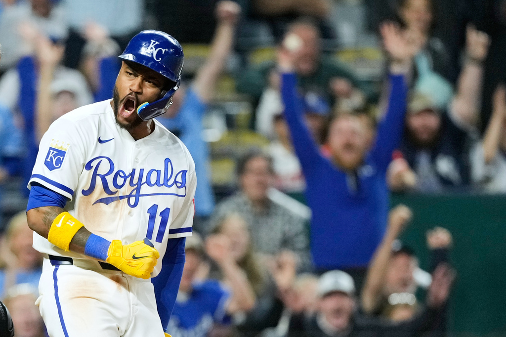 Kansas City Royals' Maikel Garcia celebrates after scoring the game-winning run on a wild pitch thrown by Baltimore Orioles relief pitcher Ryan Helsley during the ninth inning of a baseball game Tuesday, April 21, 2026, in Kansas City, Mo. (AP Photo/Charlie Riedel)