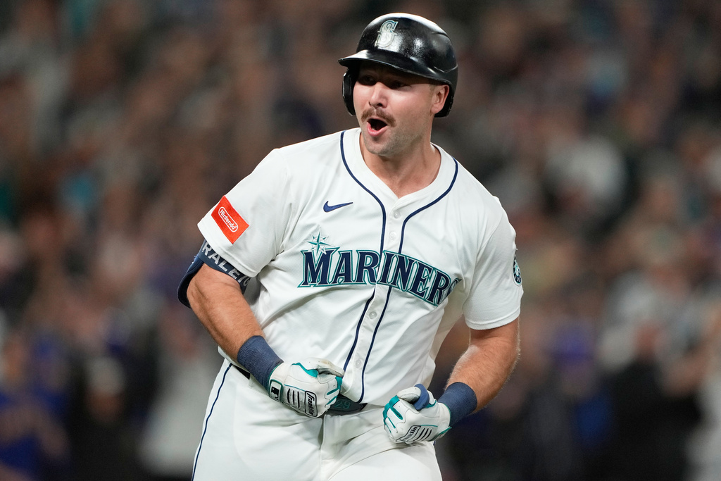 Seattle Mariners' Cal Raleigh reacts after hitting his 60th home run during the eighth inning of a baseball game against the Colorado Rockies, Wednesday, Sept. 24, 2025, in Seattle. (AP Photo/Ryan Sun)