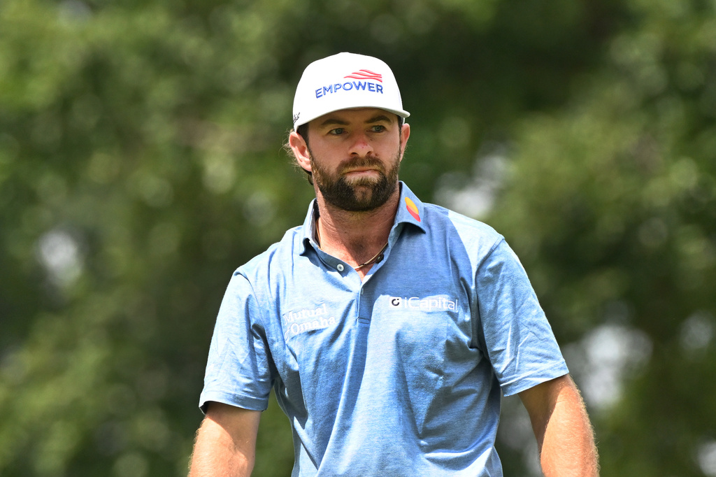 Cameron Young watches his shot from the ninth tee during the first round of the Rocket Classic golf tournament at the Detroit Golf Club, Thursday, July 30, 2026, in Detroit. (AP Photo/Jose Juarez)