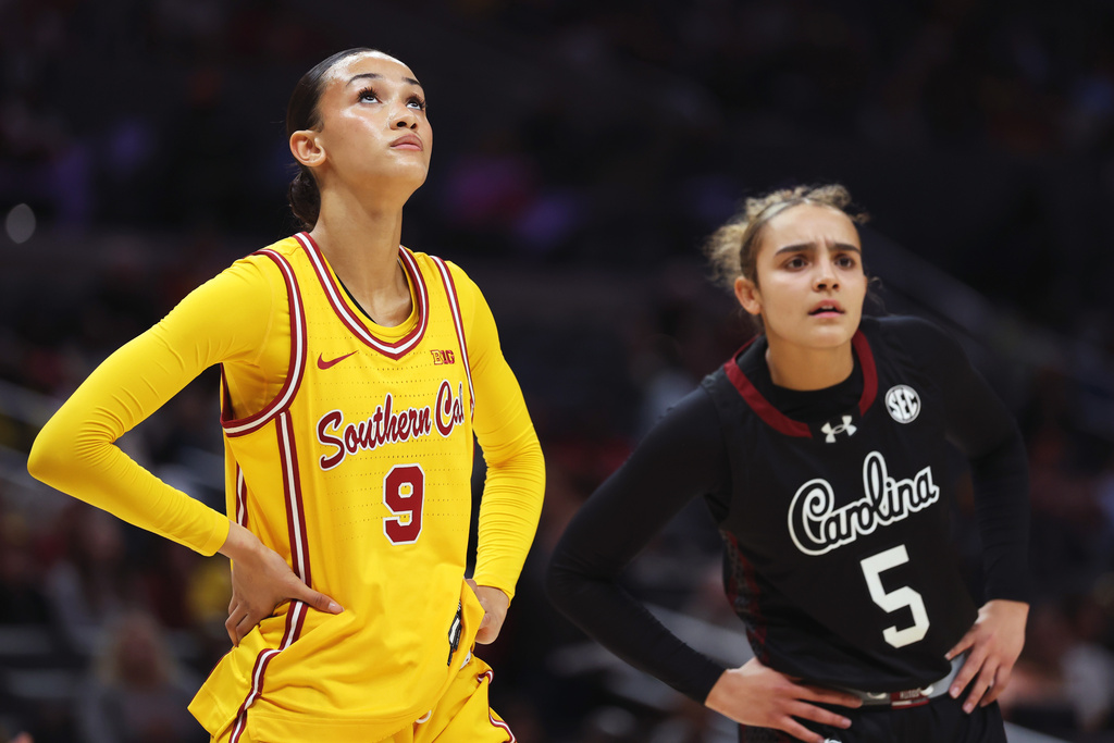 Southern California guard Jazzy Davidson (9) and South Carolina guard Tessa Johnson (50 look downcourt during the first half of an NCAA college basketball game Saturday, Nov. 15, 2025, in Los Angeles. (AP Photo/Allison Dinner)