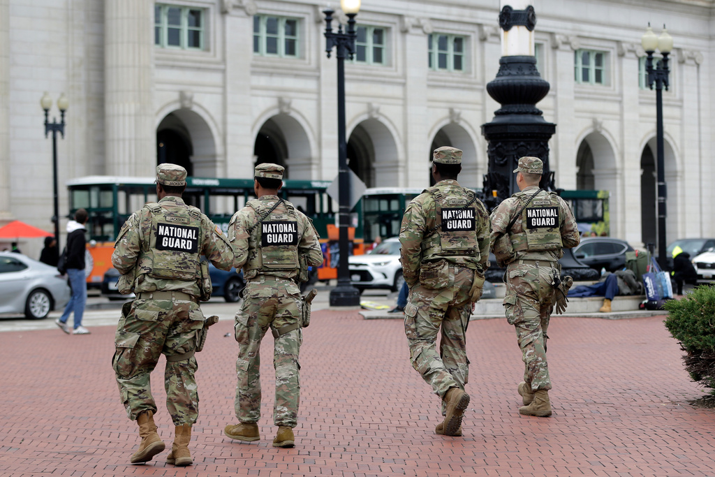 National Guard soldiers patrol at Union Station, Tuesday, Oct. 28, 2025, in Washington. (AP Photo/Rahmat Gul)