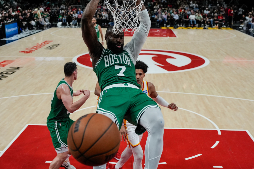 Boston Celtics guard Jaylen Brown (7) dunks against the Atlanta Hawks in the second half of an NBA basketball game, Monday, March 30, 2026, in Atlanta. (AP Photo/Mike Stewart)