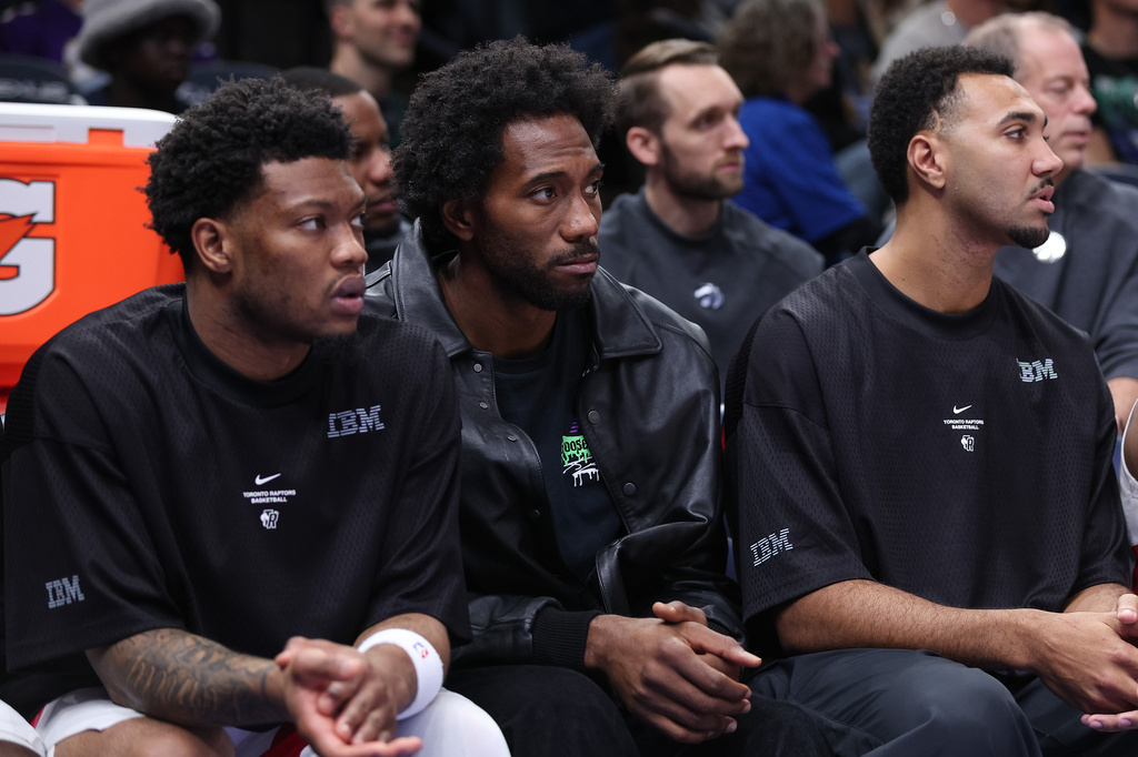 Toronto Raptors forward Kawhi Leonard, middle, looks on during the second half of an NBA basketball game against the Minnesota Timberwolves, Sunday, Oct. 25, 2026, in Minneapolis. (AP Photo/Bailey Hillesheim)