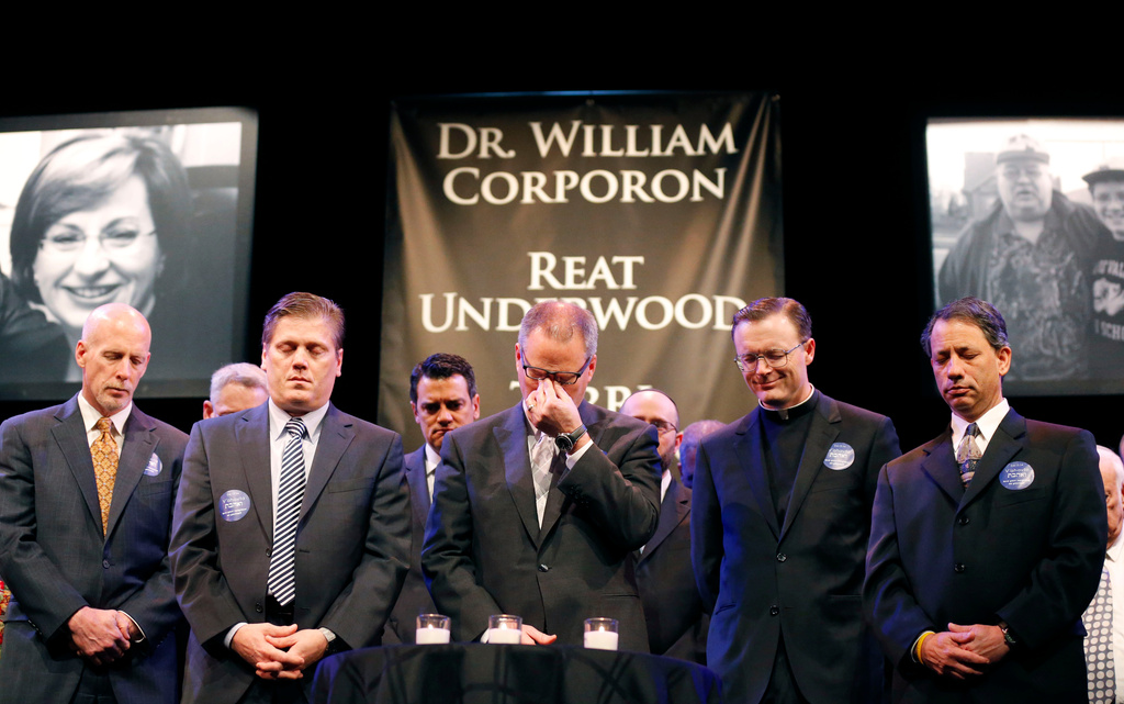 FILE - Rev. Adam Hamilton wipes his eyes during a prayer at an Interfaith Service of Unity and Hope at the Jewish Community Center in Overland Park, Kan., Thursday, April 17, 2014, to honor shooting victims at the center and a nearby Jewish retirement complex. (AP Photo/Orlin Wagner, Pool, File)