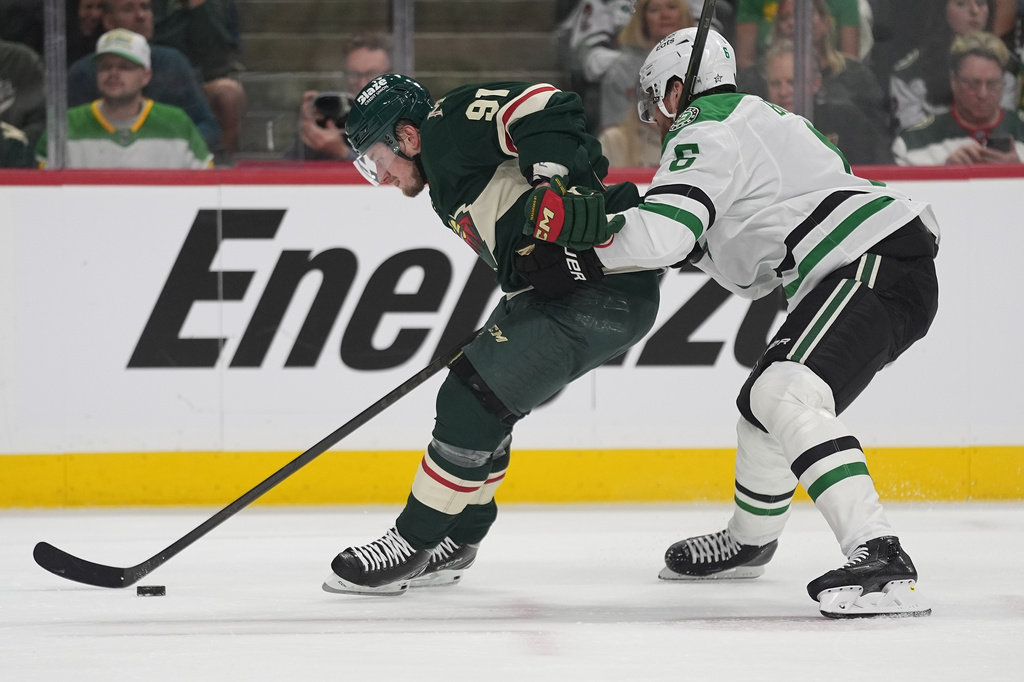 Minnesota Wild right wing Vladimir Tarasenko (91) skates with the puck as Dallas Stars defenseman Lian Bichsel (6) defends during the first period of Game 3 in the first-round of the NHL Stanley Cup hockey playoffs Wednesday, April 22, 2026, in St. Paul, Minn. (AP Photo/Abbie Parr)