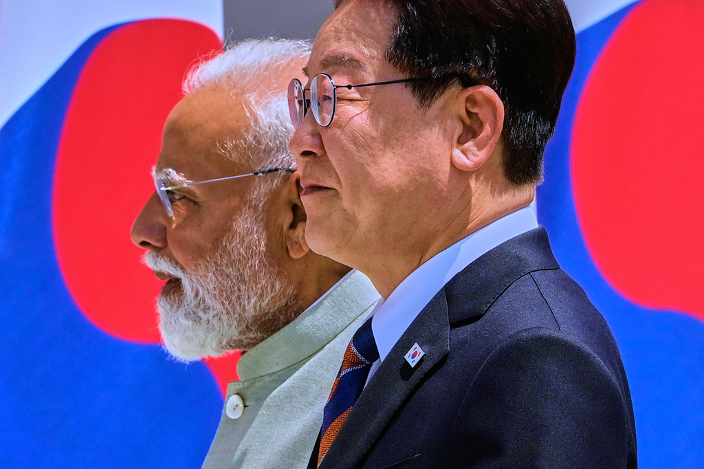 Indian Prime Minister Narendra Modi, left, and South Korean President Lee Jae Myung walk to delegation level meeting in New Delhi, India, Monday, April 20, 2026. (AP Photo/Manish Swarup)