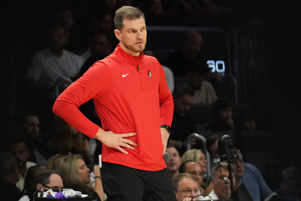 Portland Trail Blazers acting head coach Tiago Splitter watches during the first half of an NBA basketball game against the Miami Heat, Saturday, Nov. 8, 2025, in Miami. (AP Photo/Lynne Sladky)