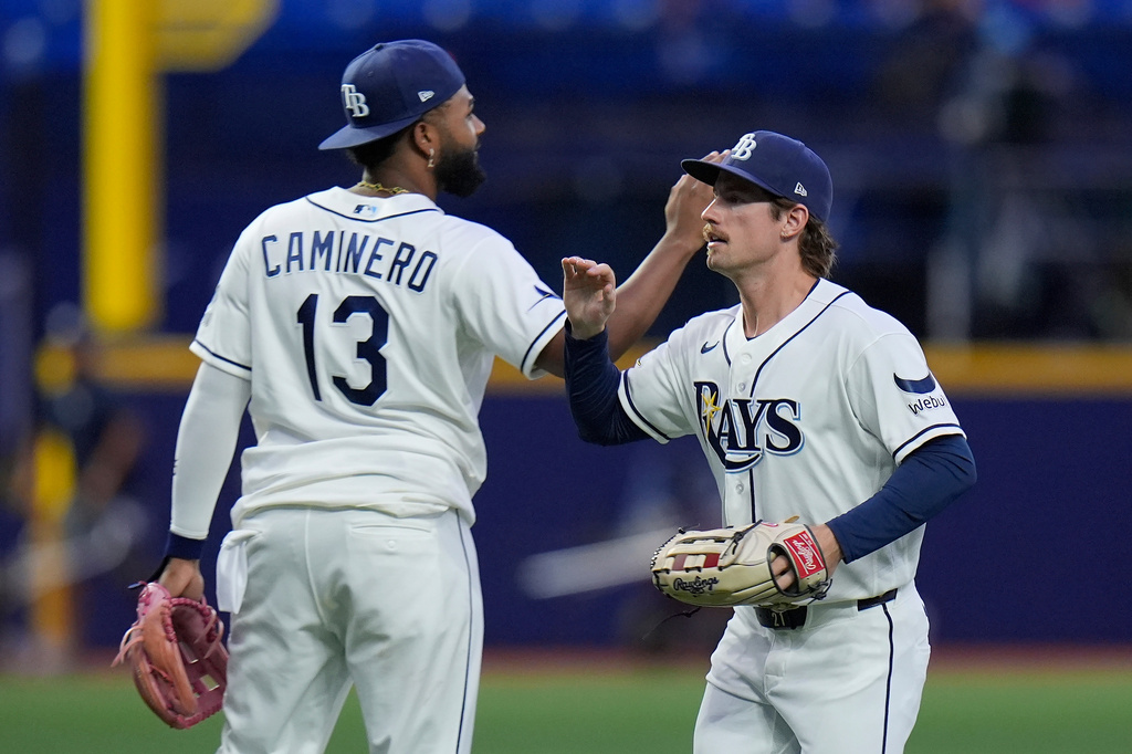 Tampa Bay Rays' Jonny DeLuca celebrates with third baseman Junior Caminero (13) after the team defeated the Baltimore Orioles during a baseball game Monday, Aug. 17, 2026, in St. Petersburg, Fla. (AP Photo/Chris O'Meara)
