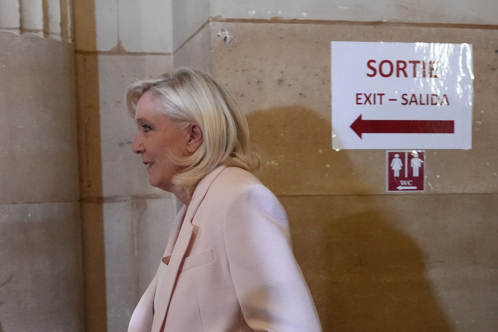 Far-right leader Marine Le Pen arrives at the courtroom for the verdict of her appeals trial, in Paris, France, Tuesday, July. 7, 2026. (AP Photo/Aurelien Morissard)