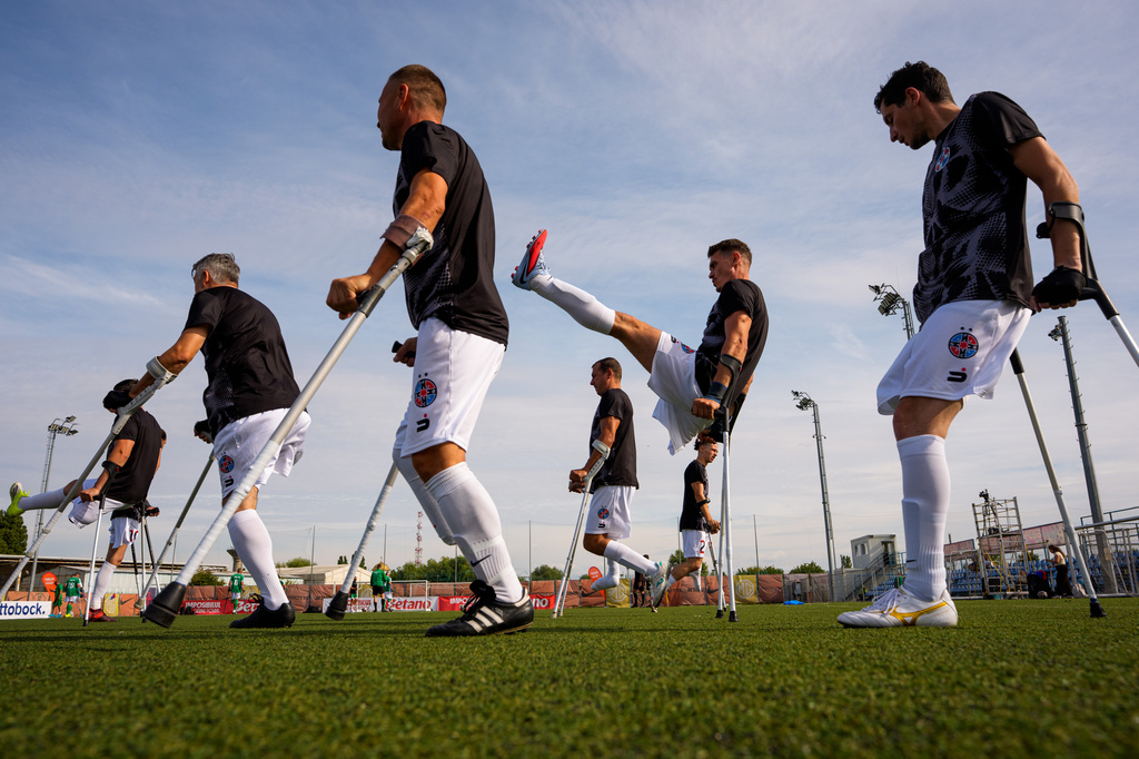 FCSB's players warm-up before an amputee soccer match between FCSB and Panathinaikos in the inaugural EAFF Conference League in Bucharest, Romania, Friday, Sept. 25, 2026. (AP Photo/Andreea Alexandru)