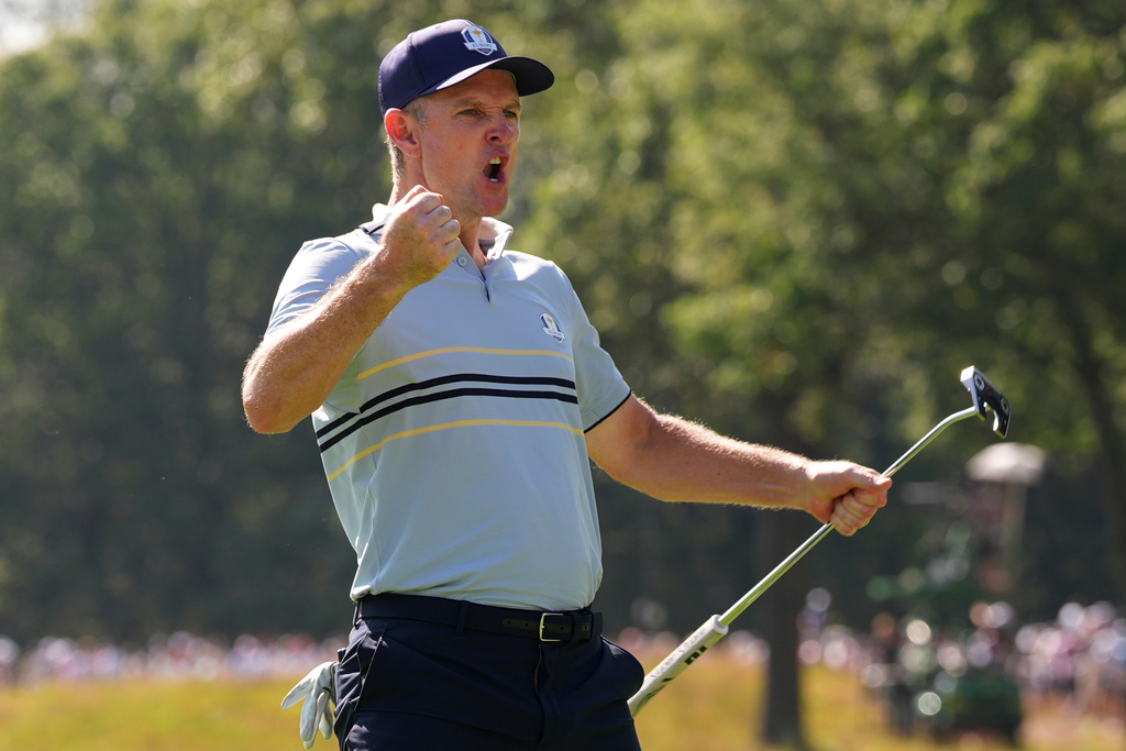Europe's Justin Rose celebrates after a birdie on the seventh hole at Bethpage Black golf course during the Ryder Cup golf tournament, Friday, Sept. 26, 2025, in Farmingdale, N.Y. (AP Photo/Lindsey Wasson)