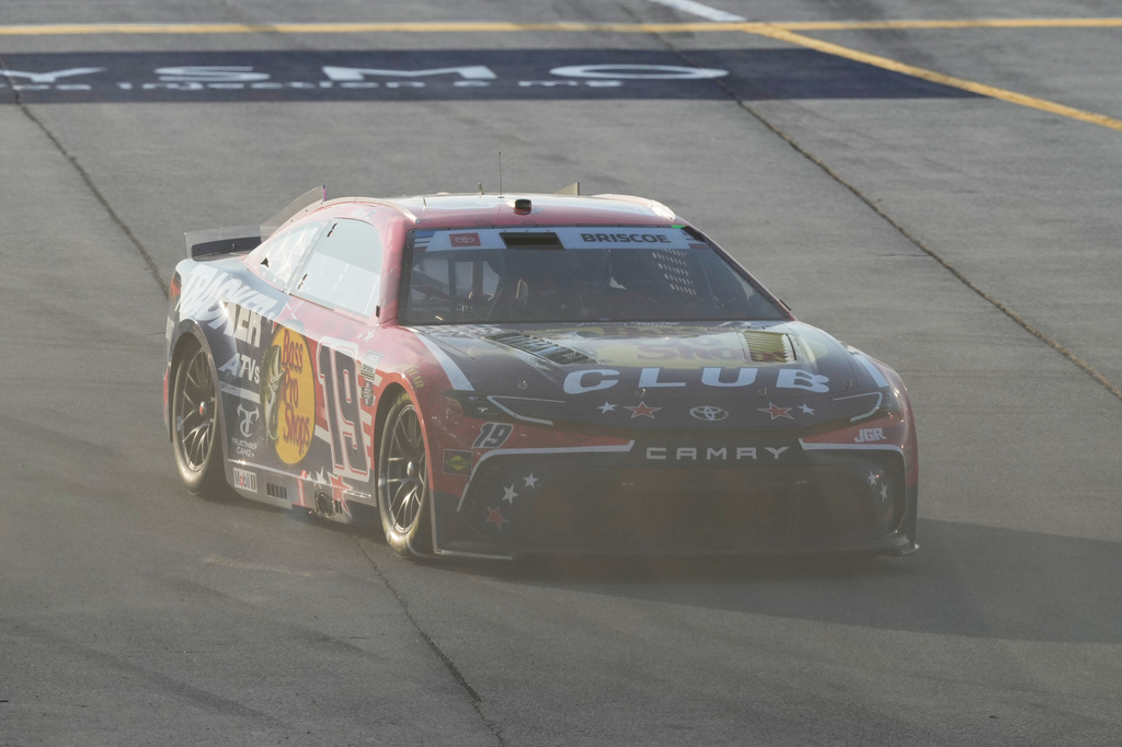 Chase Briscoe (19) drives to the track after making a pit stop during a NASCAR Cup Series auto race at Chicagoland Speedway in Joliet, Ill., Sunday, July 5, 2026. (AP Photo/Nam Y. Huh)