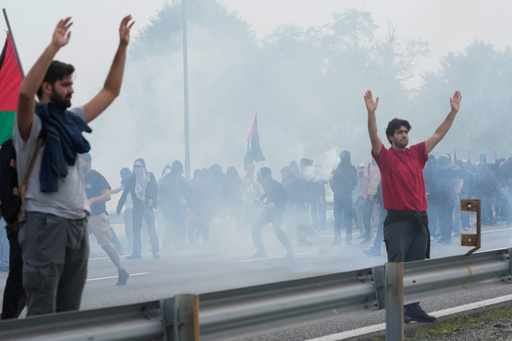 Pro-Palestinian demonstrators march along the Milan's ring road as they gather for a national general strike called by different unions to protest against the situation in Gaza two days after Israeli forces intercepted a Gaza-bound aid flotilla in the Mediterranean Sea, in Milan, Italy, Friday, Oct. 3, 2025. (AP Photo/Luca Bruno) Pro-Palestinian demonstrators march along the Milan's ring road as they gather for a national general strike called by different unions to protest against the situation in Gaza two days after Israeli forces intercepted a Gaza-bound aid flotilla in the Mediterranean Sea, in Milan, Italy, Friday, Oct. 3, 2025. (AP Photo/Luca Bruno)