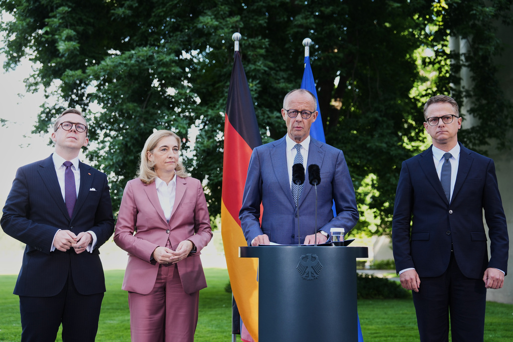 From left: Federal Chancellor Friedrich Merz arrives with Philipp Amthor, Nina Warken and Carsten Linnemann and for statement about planned personnel changes in his government at the chancellery in Berlin, Germany, Friday, July 24, 2026. (AP Photo/Markus Schreiber)