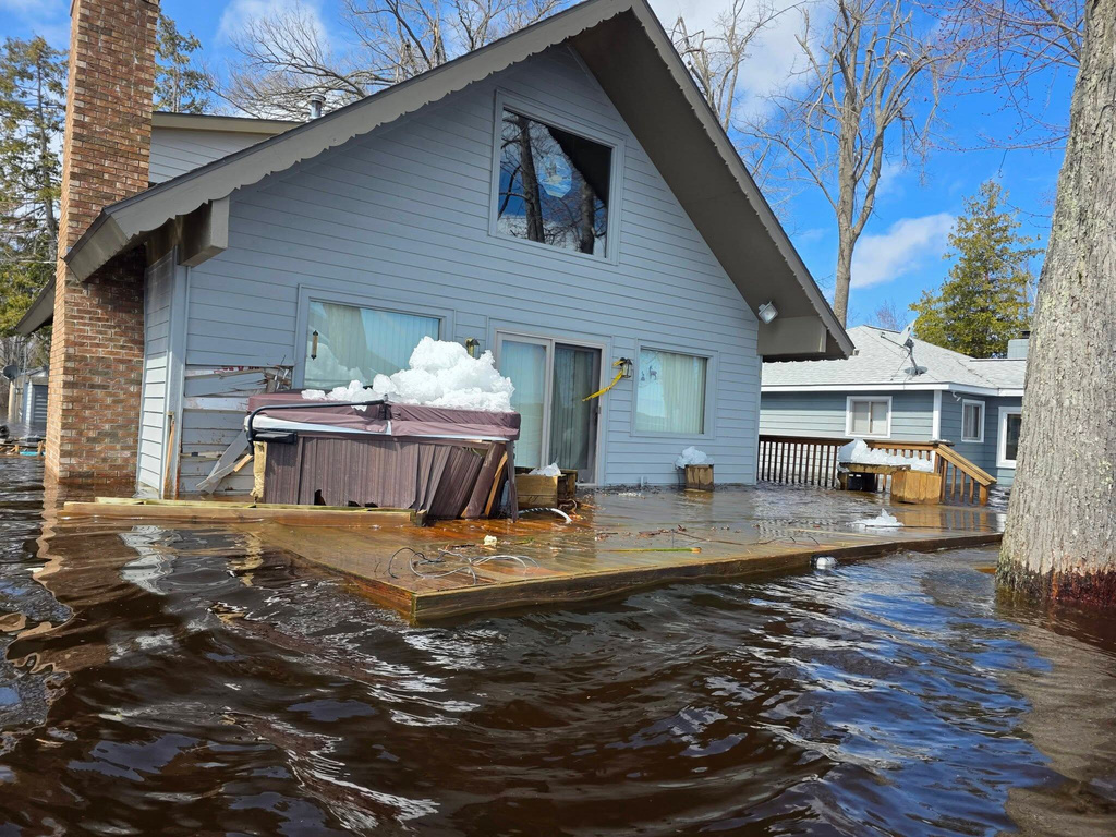 This image provided by Christopher Narsesian shows chunks of ice and flooding in Michigan’s Black Lake in the northeastern Lower Peninsula on April 19, 2026. (Christopher Narsesian via AP)