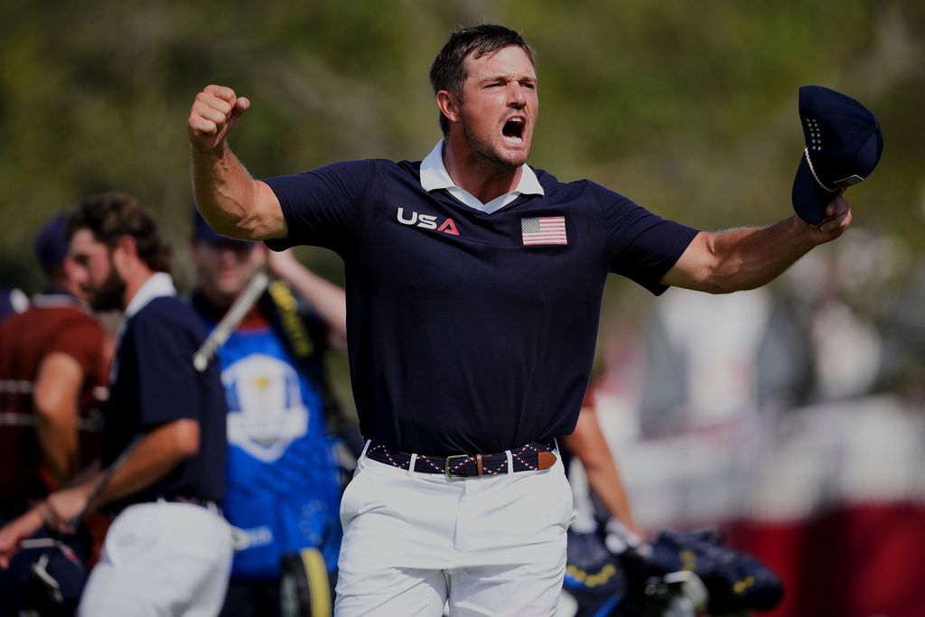 United States' Bryson DeChambeau celebrates after their match win at Bethpage Black golf course during the Ryder Cup golf tournament, Saturday, Sept. 27, 2025, in Farmingdale, N.Y. (AP Photo/Matt Slocum)