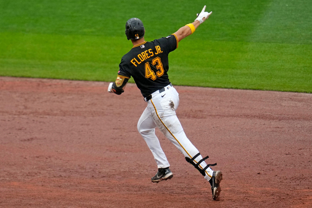 Pittsburgh Pirates' Rafael Flores Jr. rounds the bases after hitting a two-run home run off Kansas City Royals pitcher Nate Pearson during the eighth inning of a baseball game in Pittsburgh, Sunday, Sept. 20, 2026. (AP Photo/Gene J. Puskar)