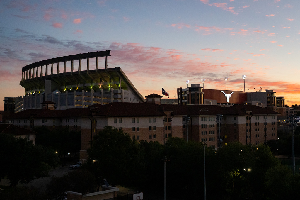 The sun rises over Royal-Memorial Stadium ahead of the NCAA college football game between the Texas and Florida on Saturday, Oct. 17, 2026. (Sara Diggins/The San Antonio Express-News via AP)