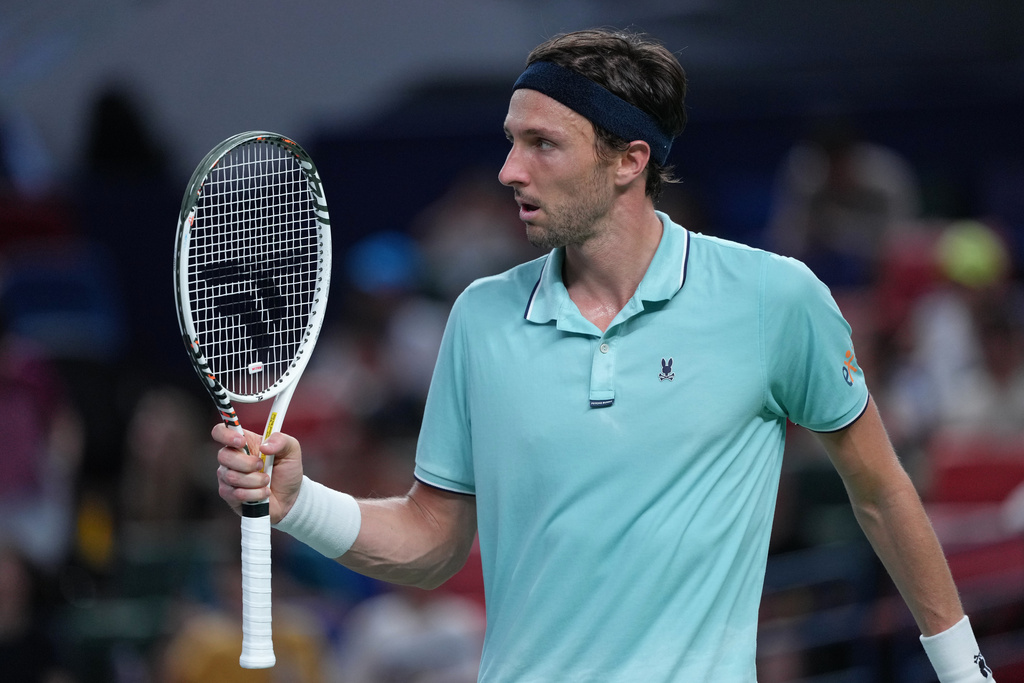 Arthur Rinderknech of France reacts after scoring a point against Alexander Zverev of Germany during the men's singles match of the Shanghai Masters tennis tournament at Qizhong Forest Sports City Tennis Center, in Shanghai, China, Monday, October. 6, 2025. (AP Photo/Andy Wong)