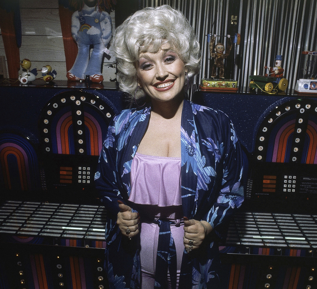 FILE - Singer and Actress Dolly Parton shown at a party following the premiere of her movie 'Nine to Five' in Los Angeles, Dec. 12, 1980. (AP Photo/Harms, File)