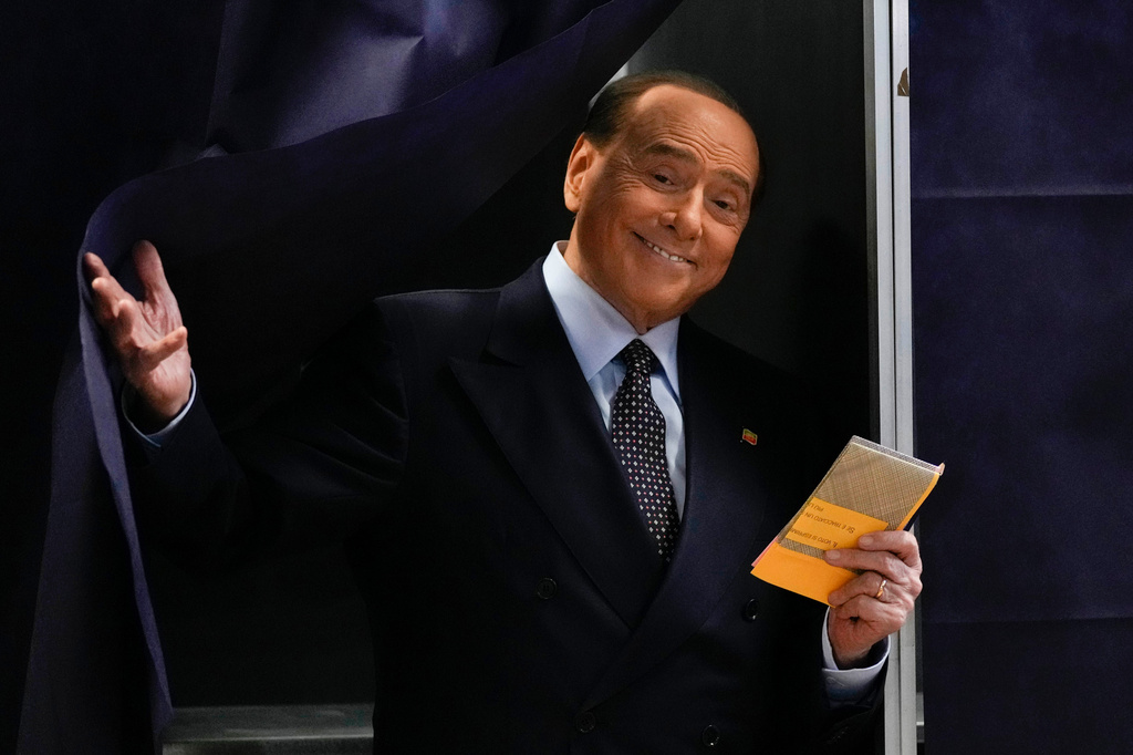 FILE - Silvio Berlusconi, leader of center-right, populist Forza Italia exits a voting booth before casting his ballot at a polling station in Milan, Italy, Sept. 25, 2022. (AP Photo/Antonio Calanni, File)