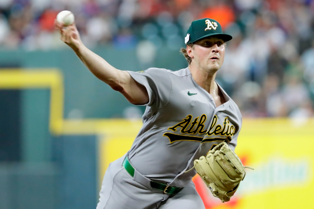 Athletics starting pitcher Jack Perkins throws against the Houston Astros during the first inning of a baseball game Friday, June 5, 2026, in Houston. (AP Photo/Michael Wyke)