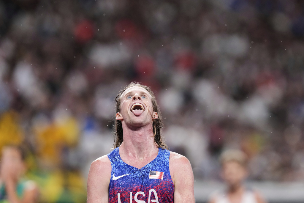 United States' Cole Hocker reacts after winning the men's 5,000 meters final at the World Athletics Championships in Tokyo, Sunday, Sept. 21, 2025. (AP Photo/Eugene Hoshiko)